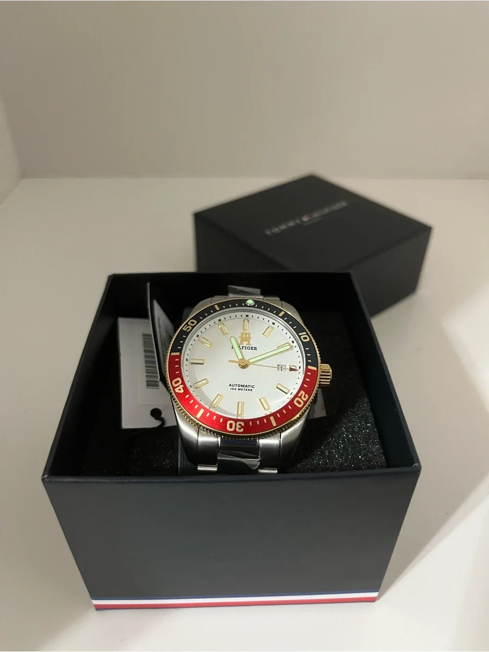 Tommy Hilfiger Silver Dial Men’s Watch with Red and Black Bezel